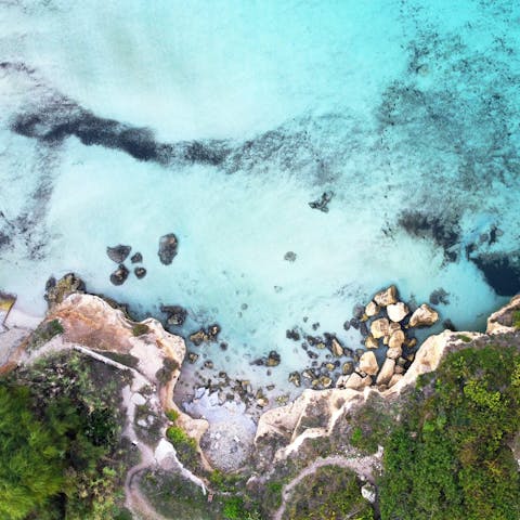 Swim in the crystal-clear waters at Fontane Bianche, just a twenty-five minute drive away