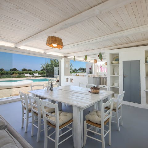 Gather around the open kitchen area with views over the pool for an Italian aperitif of locally sourced wine and olives