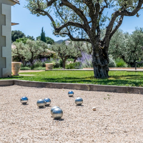Catch up over a game of pétanque in the sunshine