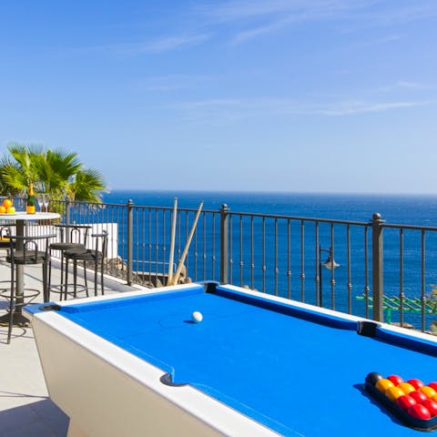 Play billiards on the terrace with panoramic sea views