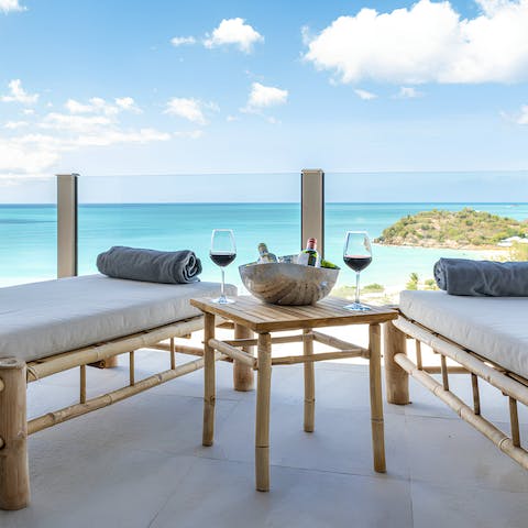 Enjoy a glass of wine while taking in the views of the Caribbean