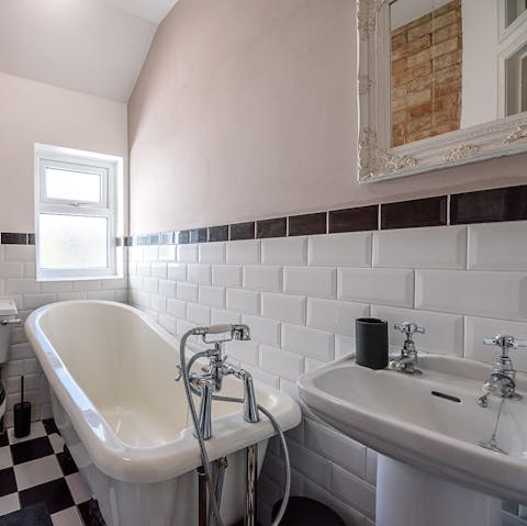 Treat yourself to a long and luxurious soak in the freestanding bathtub