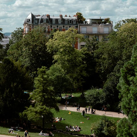 Enjoy a picnic in Parc des Buttes-Chaumont, ten minutes away