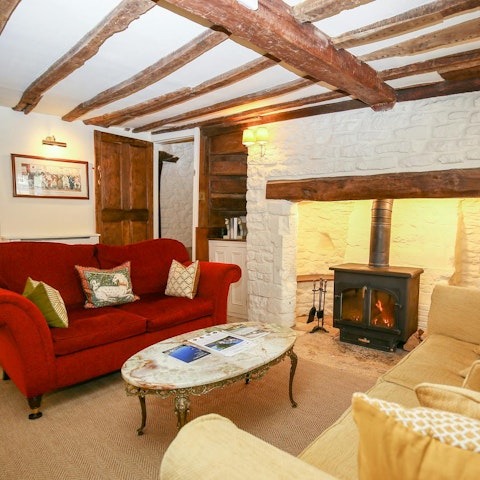 Curl up around the wood-burning stove of this Grade II listed cottage