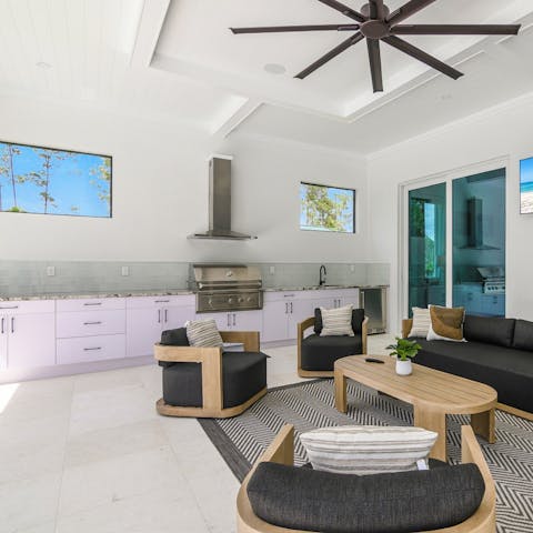 Fire up the grill in the outdoor kitchen area