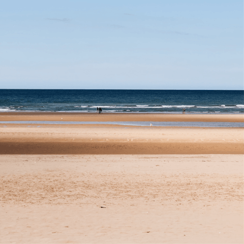 Take the short twelve-minute stroll to Deauville beach and feel the sand between your toes