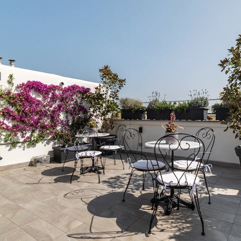 Unwind in the Roman sun on the shared roof terrace