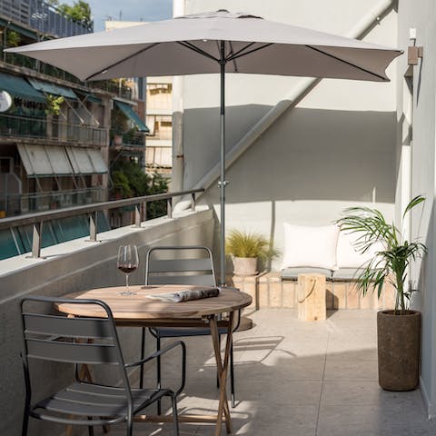 Sip on a glass of wine while soaking up the sunshine on the private balcony