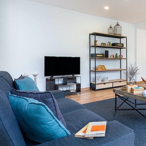 Stretch out and relax on the plush sofa after a long day of exploring Seville