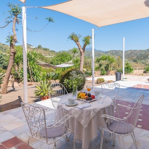 Sit down for plates of tapas and paella on the outdoor table