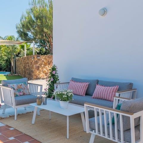 Chill on the comfy cushions with a bottle of Sangria