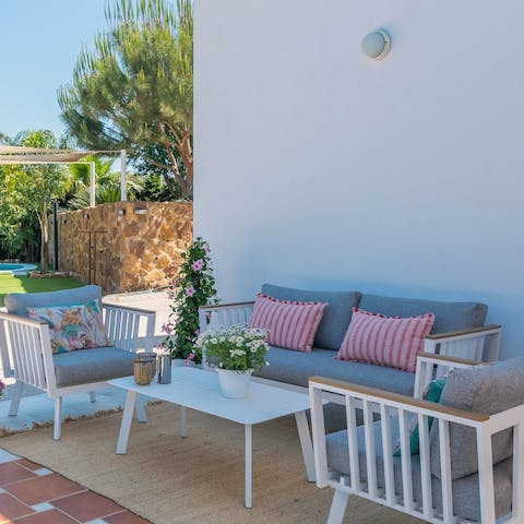 Chill on the comfy cushions with a bottle of Sangria