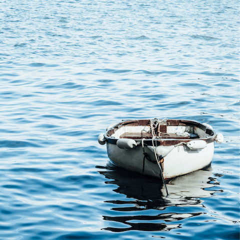 Head out exploring on a rowing boat