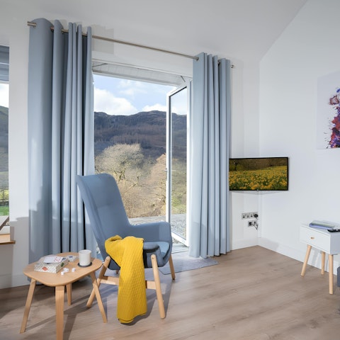 Relax with a good book in the cosy living room