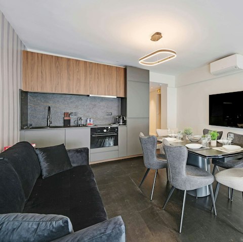 Relax in the open-plan living area with a glass of French wine