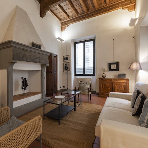 Relax in your beamed living area with a glass of Italian wine after a day of exploring