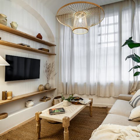 Have movie nights in with a glass of Spanish wine amidst the soothing interiors of the living room