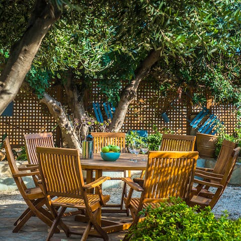 Gather around the alfresco dining table for an array of Greek dishes
