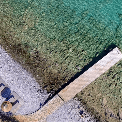 Soak up the Aegean rays from Plaka Beach, just 900m away