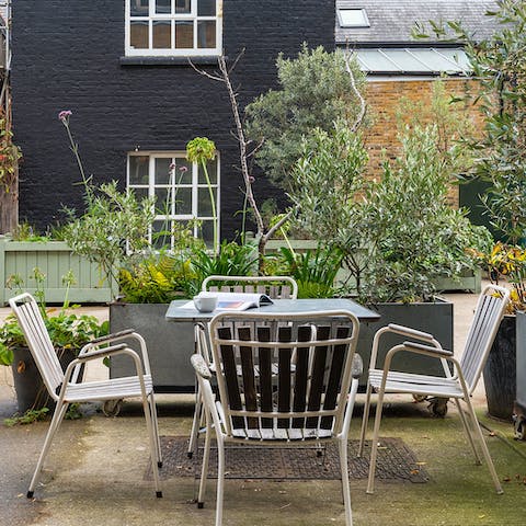 Enjoy sundowners and a barbecue in the quiet courtyard garden