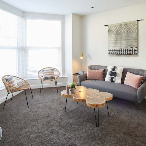 Relax on the rattan chairs in the bay window