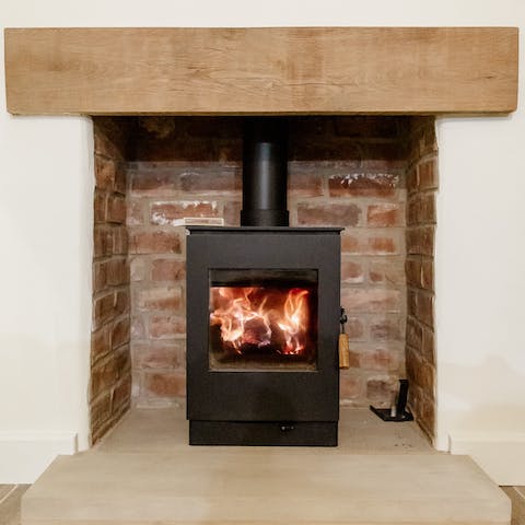 Cosy up in front of the log burner fire on cold winter's evenings