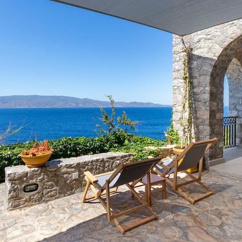 Lounge on the chairs watching the gorgeous views of the Aegean Sea