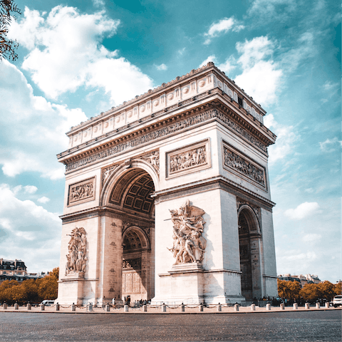 Climb the Arc de Triomphe and witness stunning views of the Eiffel Tower