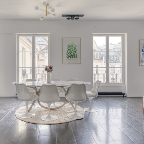 Admire the Place des Petits-Pères views from the dining table