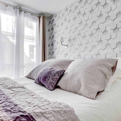 Wake up to sunlight streaming through the French windows