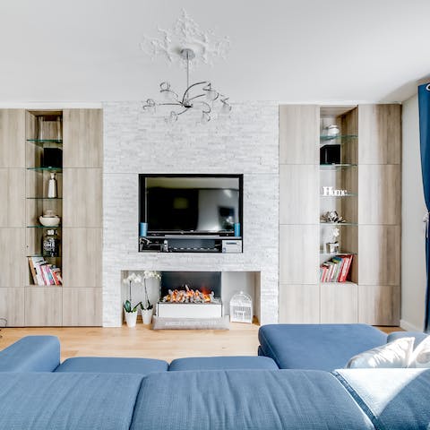 Kick back after a busy day sightseeing on the squishy blue sofa