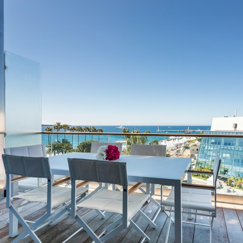 Drink in views of the bay and Palais des Festivals on the terrace
