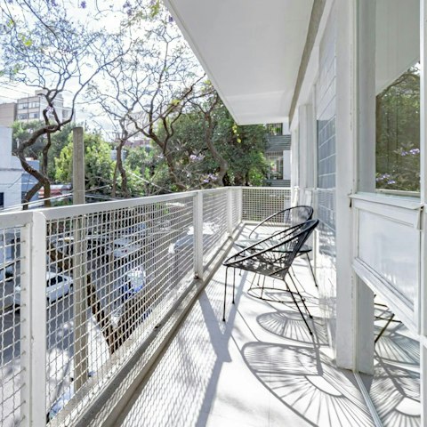 Savour refreshing drinks while relaxing on the balcony