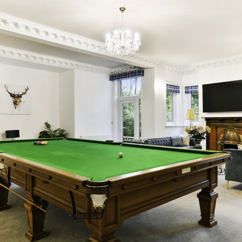 Make use of the billiard room for some friendly sport