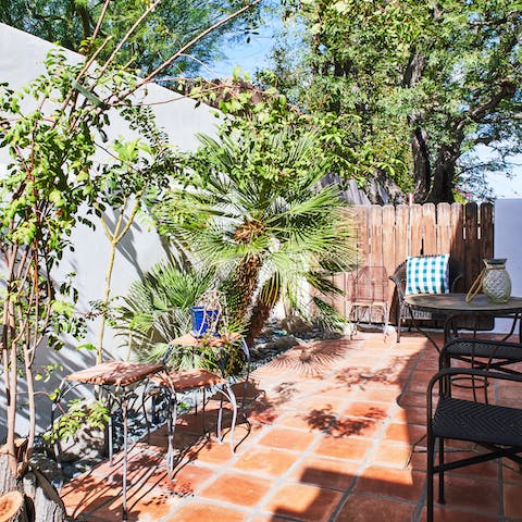 Have your morning coffee on the lush patio