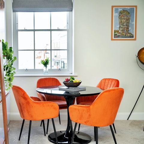 Peer out over the bustling market square while enjoying a lazy breakfast