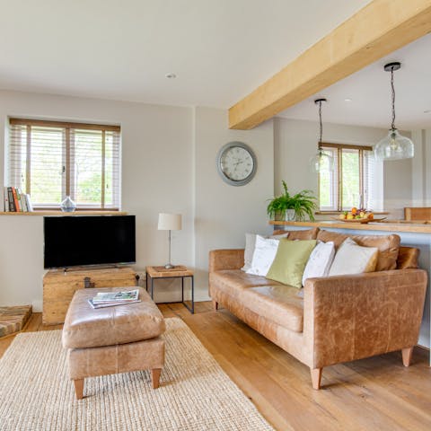 Snuggle up on the plush leather sofa for a movie night in front of the fire