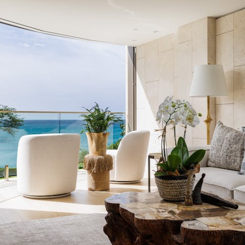 Relax with a Mai Tai while admiring the ocean views