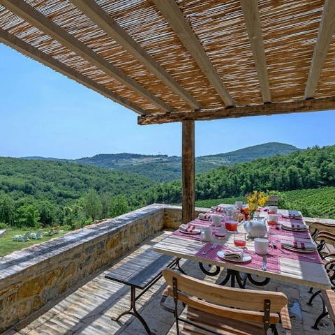 Dine alfresco with a gorgeous view of the Tuscan landscape