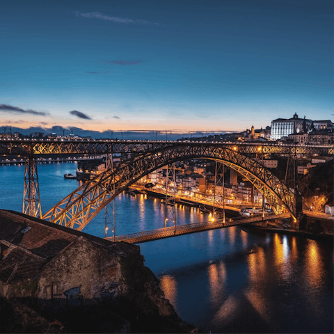 Cross the Luis I Bridge and visit the port wine cellars