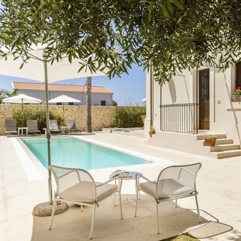 Take a dip in the serene, azure pool