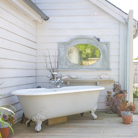Have an alfresco soak in the deep roll top bath