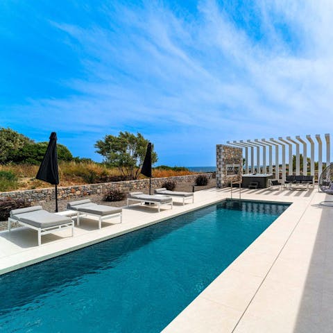 Cool off in the Greek sunshine with a dip in the pool