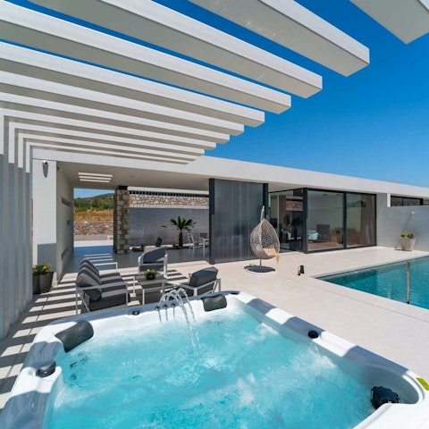 Unwind in the hot tub after a busy day at the beach