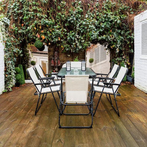 Take a break from urban life by serving dinner out in the peaceful patio space