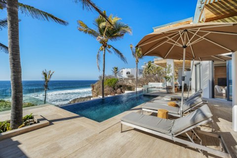 Swim above the crashing waves of the Pacific