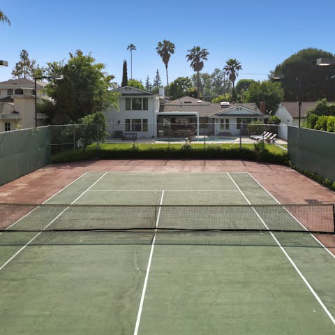 Embrace energising games of tennis on the private court