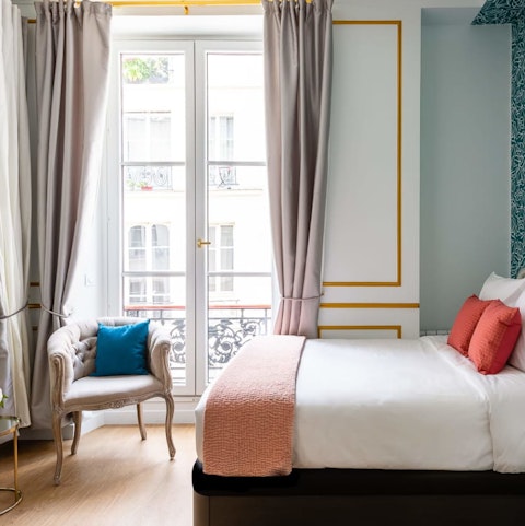 Take in the buzz of the Parisian streets below