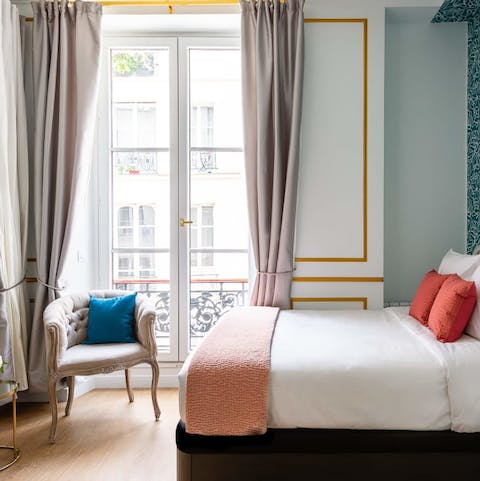 Take in the buzz of the Parisian streets below
