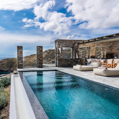 Cool off with a swim in the dazzling infinity pool, admiring the Aegean views